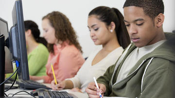High school students working on computers